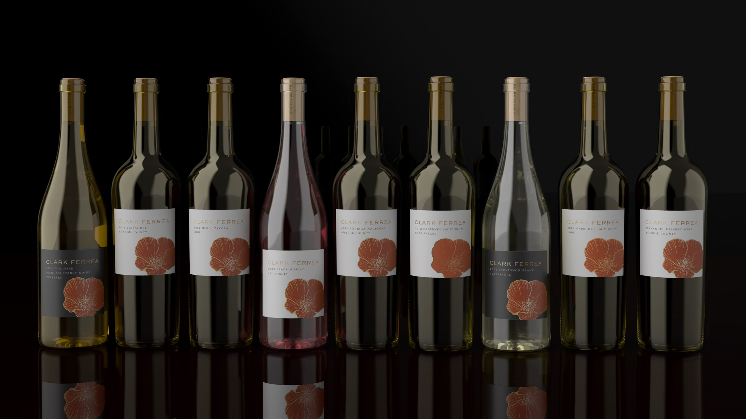 A stylized photo showing all nine of our Clark Ferrea inaugural vintages, lined up side by side in 750ml wine bottles.